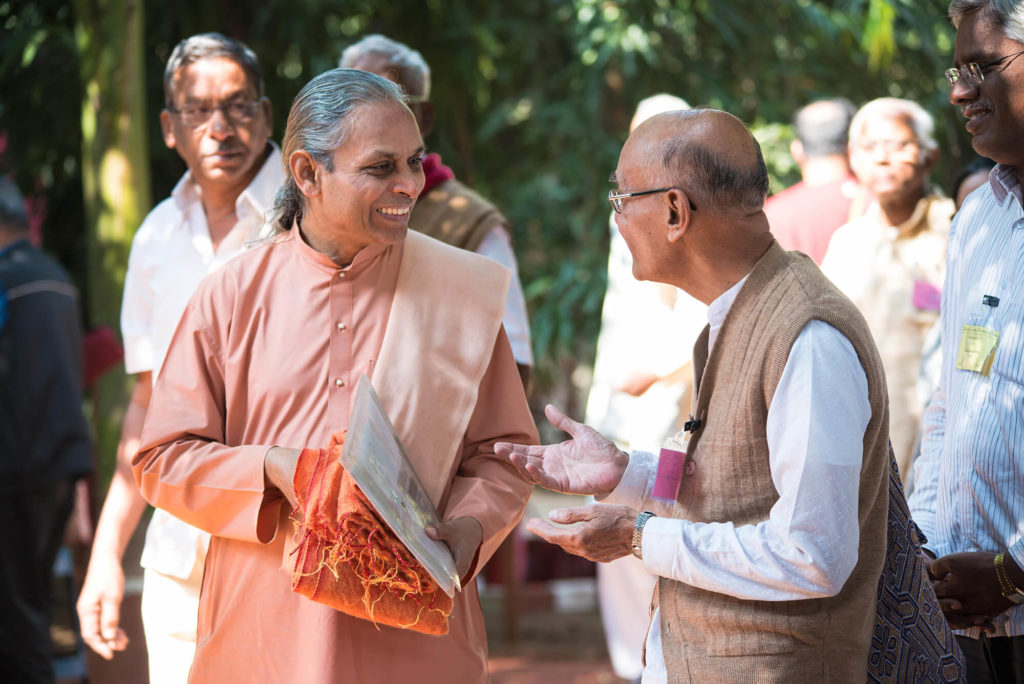 YSS Vice-president Swami Smarnananda speaking to a devotee