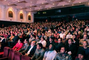 Capacity audience listen attentively in Kolkata.