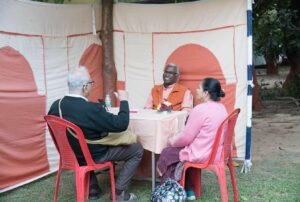 Swami Pavitrananda with devotees at counseling session.