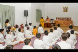 Swami Vasudevananda welcomes the boys.