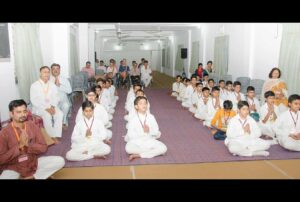 Boys and volunteers join in prayer and meditation.