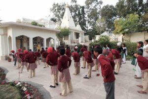 Children practice Energization Exercises before group meditation.