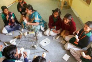 Class on papier mache activity.