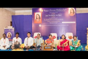 Devotees sing Cosmic Chants before the evening public event.