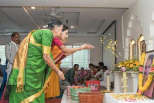 Devotees offer flowers.