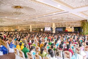 Devotees listen to a talk on Guruji's teachings.