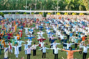 Devotees join in group Energization Exercises before the evening meditation.