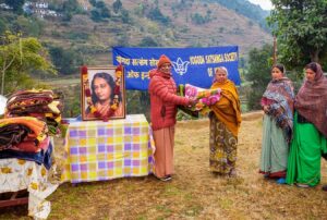 Swami Madhavananda distributes blankets, Dwarahat.