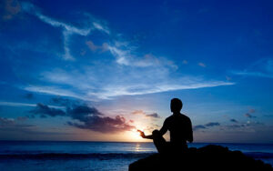 Meditation at Sea shore during sunset