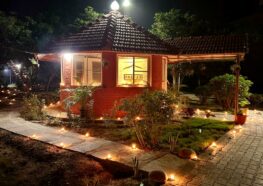 YSS Chennai Ashram Diwali 2024 - Decorated walkway with lit lamps leads to a meditation hut